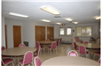 Community room with tables and chairs