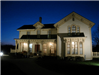 Exterior of the Alexander Blue House at Night Illuminated