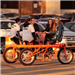 People Riding Conference Bike