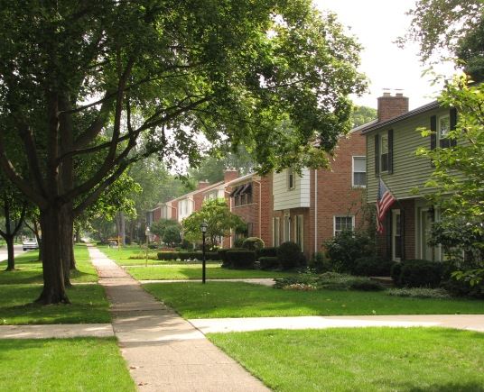Front of a House with an American Flag Hanging up