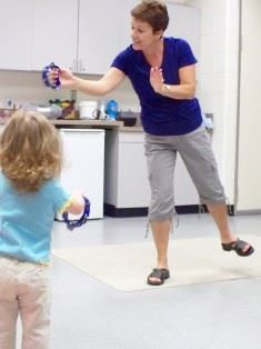 Adult Playing with Musical Instruments with Children