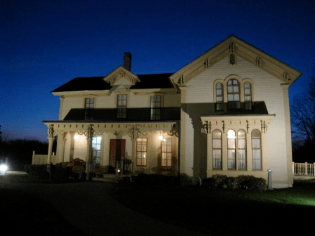 Exterior of the Alexander Blue House at Night Illuminated