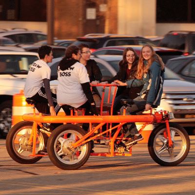 People Riding Conference Bike