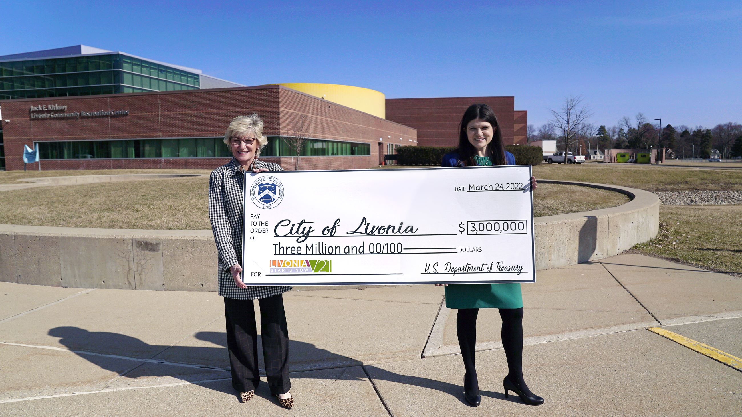 Mayor and Haley Stevens at The Rec holding giant check 