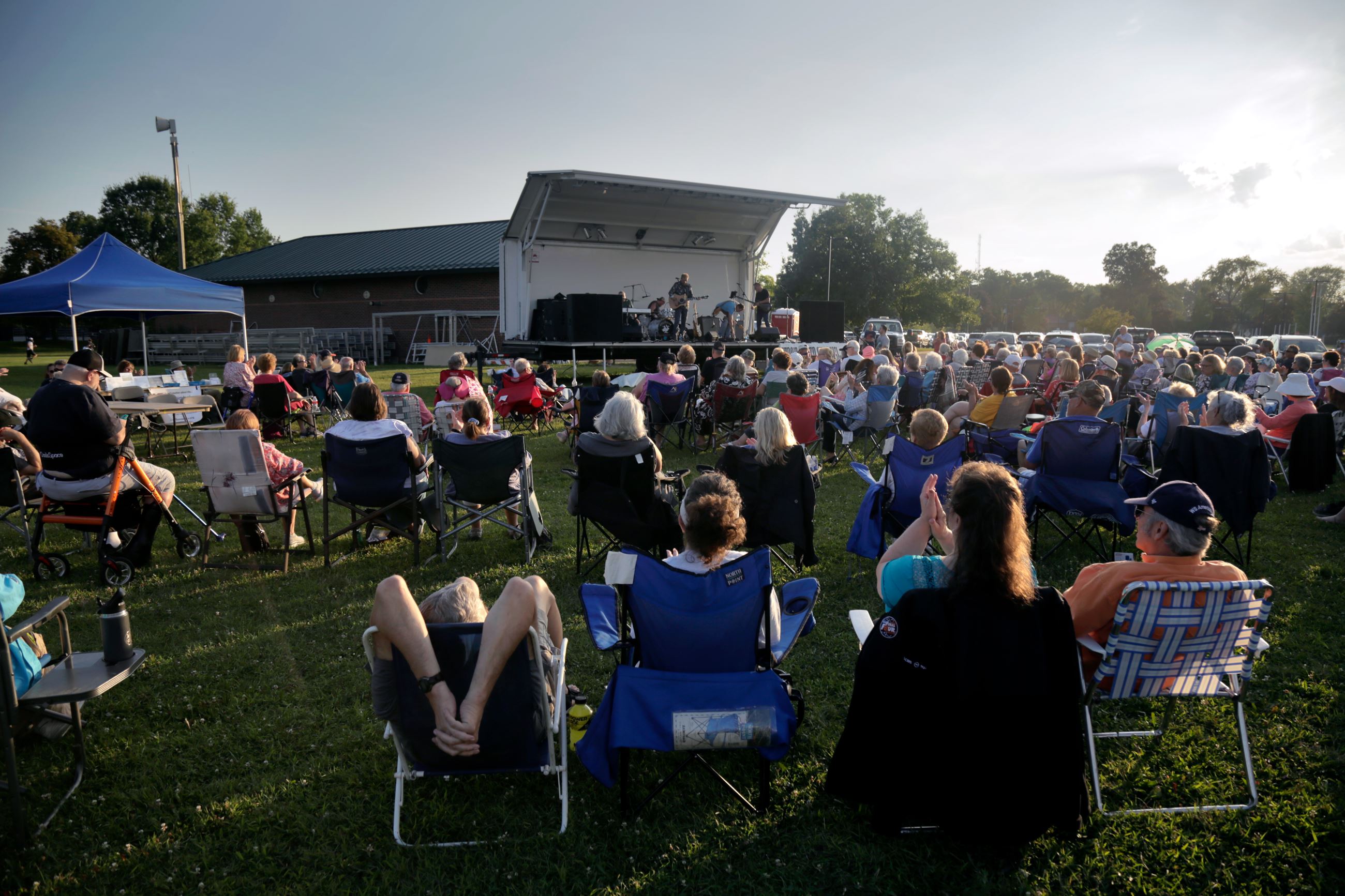Residents in Lawn Chairs Enjoying a 2023 Concert outside at the Kirksey Recreation Center