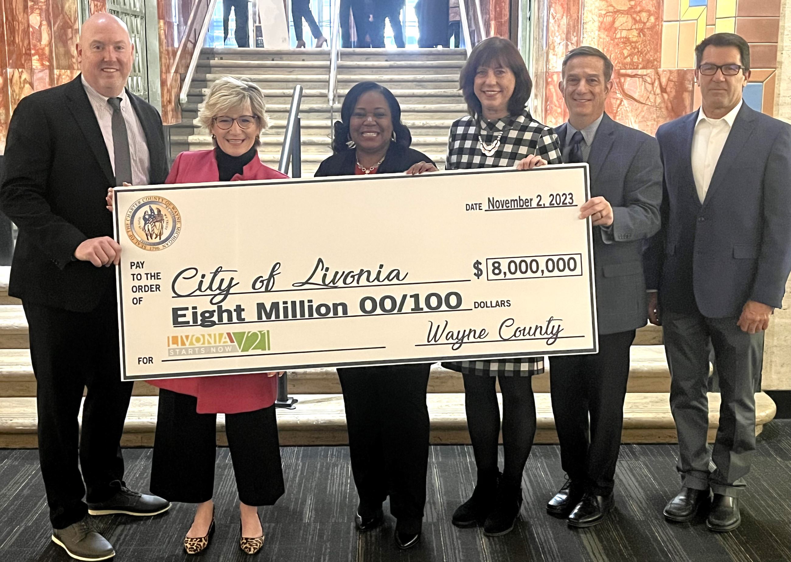 Alicia Bell with big check