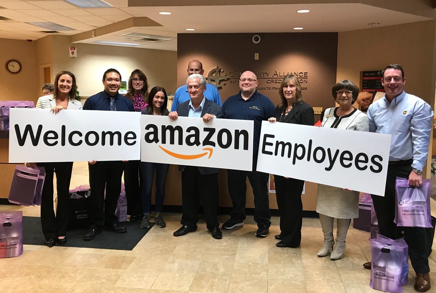 Group of People Holding Signs that Say 